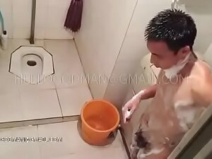 Adult Chinese man taking a shower