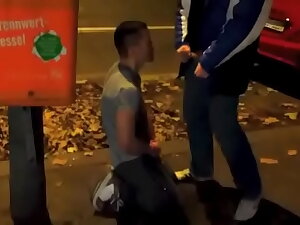 Pissing and self pissing next wide busy street